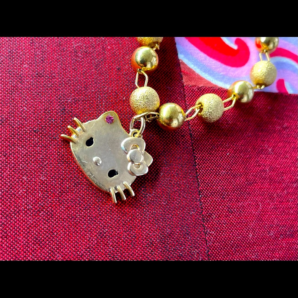 Rare Hello Kitty x Momoberry bracelet in gold metal.